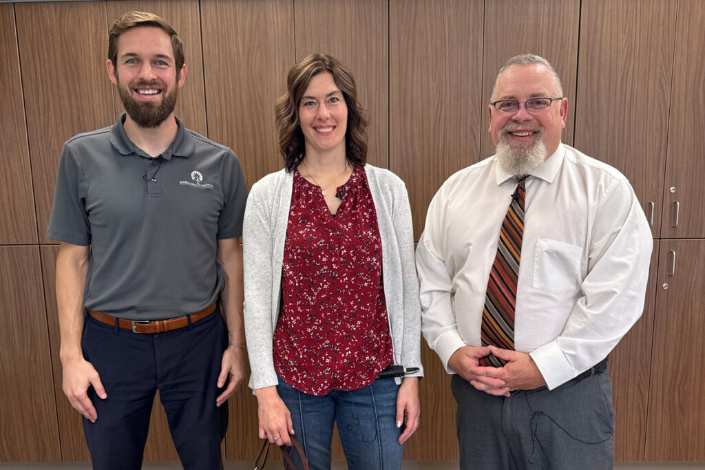 Wyatt Beckman with KHI is on the left. Logan Intergenerational Family Education (LIFE) Center leaders, David Kirkendall (right) and Teresa McComb (middle).
