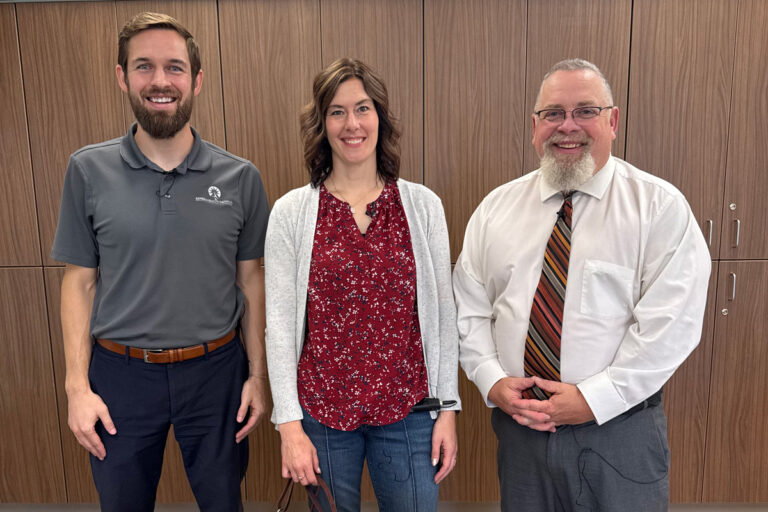Wyatt Beckman with KHI is on the left. Logan Intergenerational Family Education (LIFE) Center leaders, David Kirkendall (right) and Teresa McComb (middle).