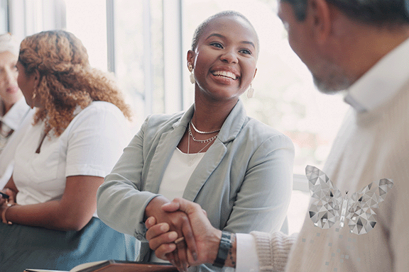 A trusting community member shaking hands with a local health department official