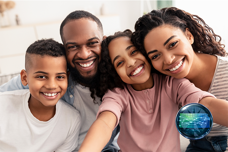 Photo of a family taking a selfie. There is a man, woman, boy and girl.